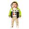 A smiling toddler stands against a plain white background wearing a bright lime green and black hooded puffer jacket over a white graphic T-shirt, tan pants, and white sneakers.