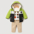 A children's three-piece winter outfit displayed on a wooden hanger against a light gray background. The set includes a lime green and black puffer jacket with a white chest panel, a white graphic t-shirt featuring cartoon animal faces, and beige pants.