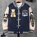 Navy and beige varsity jacket with text and logos on a gray background