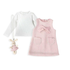 A baby girl's three-piece outfit set featuring a white long-sleeve shirt, a pink patterned sleeveless dress with a bow and pockets, and a matching pink plush bunny keychain.