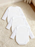Three white baby bodysuits on a beige carpet