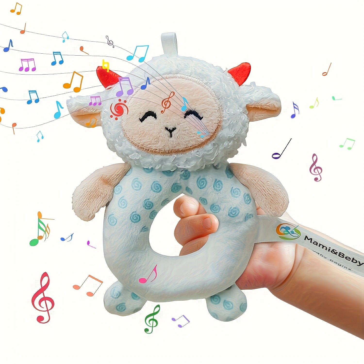 Plush lamb toy with music notes and a hand holding it, branded 'Mami&Baby'.