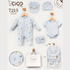 Baby boy's 3-piece clothing set from CICO kids, featuring a light blue long-sleeve footless romper with a dinosaur print, a matching short-sleeve bodysuit, and a light blue bonnet, displayed on wooden hangers with a matching storage bag and CICO gift bag.
