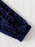 Navy blue textured fabric on a white textured surface