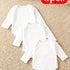 Three white baby onesies on a beige carpet with a red 'Opes' label.