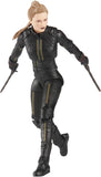 Action figure in black tactical gear with weapons on a white background