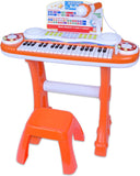 Children's toy keyboard with microphone and stool on a white background