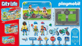 Playmobil City Life packaging with figures, vehicles, and road signs on a blue background