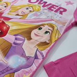 Close-up of a pink shirt with a cartoon character on a white background