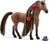 Toy horse with styled hair and accessories on a white background