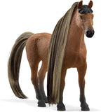 Model horse with a long mane and tail on a white background