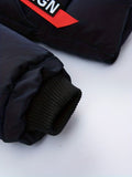 Close-up of black gloves with a brand logo on a white background
