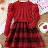 Red ribbed dress with plaid pattern on a wooden surface