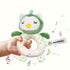 Green and white owl-shaped toy held by a hand with 'Mami&Baby' branding.