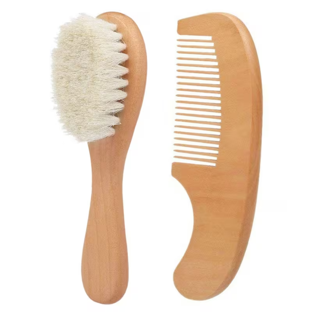 Wooden brush with bristles and wooden comb on a white background