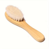 Wooden brush with bristles on a white background