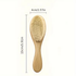 Wooden hairbrush with measurements on a white background