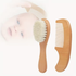 Wooden baby brush and comb set on a white background