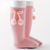Pink knee-high socks with a bow and pom-poms on a white background