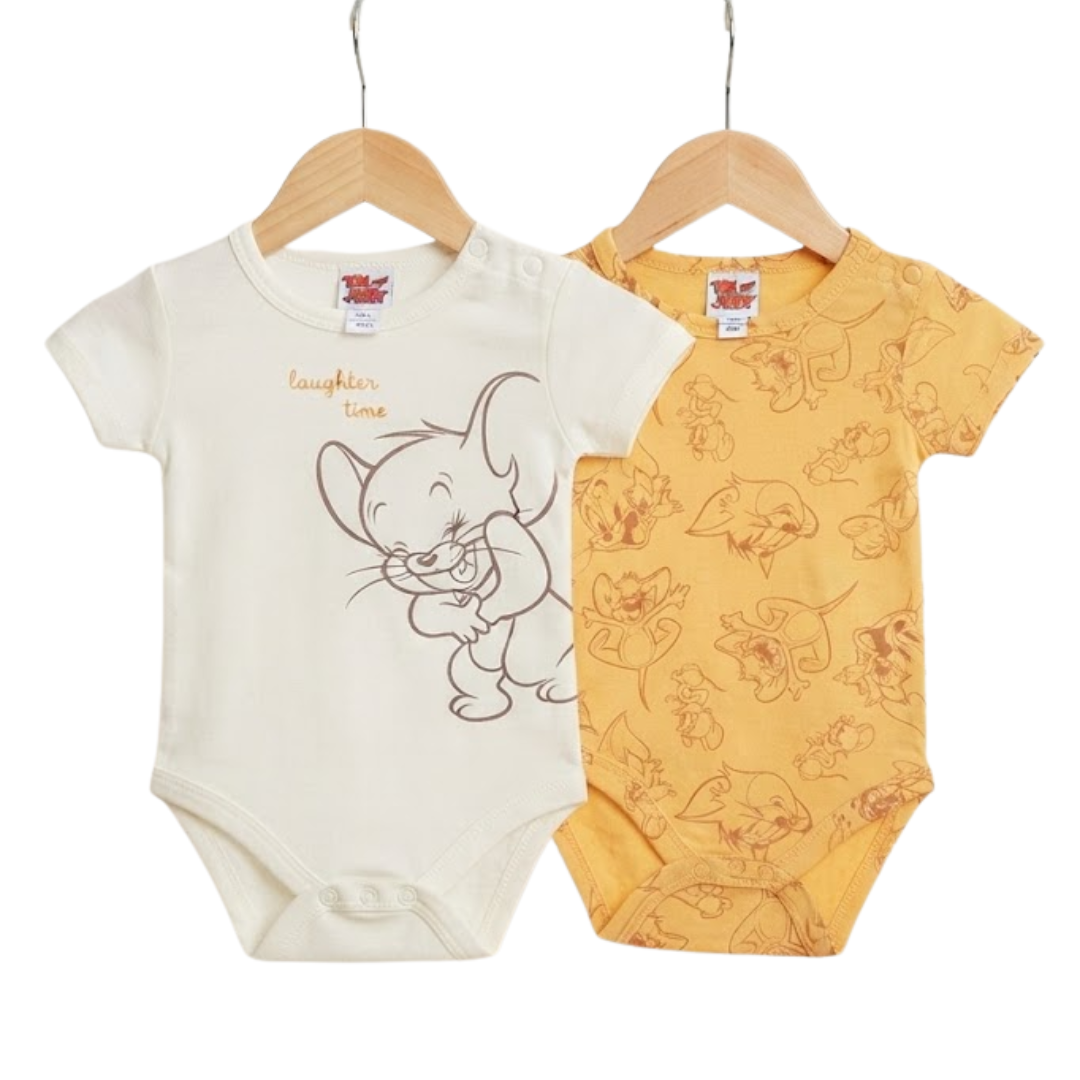 Two baby short-sleeve bodysuits hanging on wooden hangers against a white background. The left bodysuit is off-white with a brown cartoon mouse graphic and the words 'laughing love.