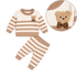 Baby boys 2-piece knitted outfit set in brown and white stripes, featuring a long-sleeve sweater with a fuzzy teddy bear applique and brown bow, matching striped pants, and a circular inset showing a close-up detail of the bear patch.