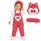A toddler wearing a red corduroy overall outfit with white heart prints, a large white heart patch with a red bow on the chest, a matching red bow headband, and white shoes. The image includes a circular close-up inset of the overall garment and a separate matching headband on a white background.
