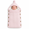 Baby pink cable-knit pram sleeping bag, swaddle blanket, and stroller bunting sack with a fleece-lined hood