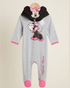 A baby footed one-piece sleeper in heather gray, featuring a large Minnie Mouse graphic on the chest, a black hood with Minnie Mouse's face and a pink bow, pink cuffs, and pink toe caps. The word 'Minnie Mouse' is printed vertically on the leg.