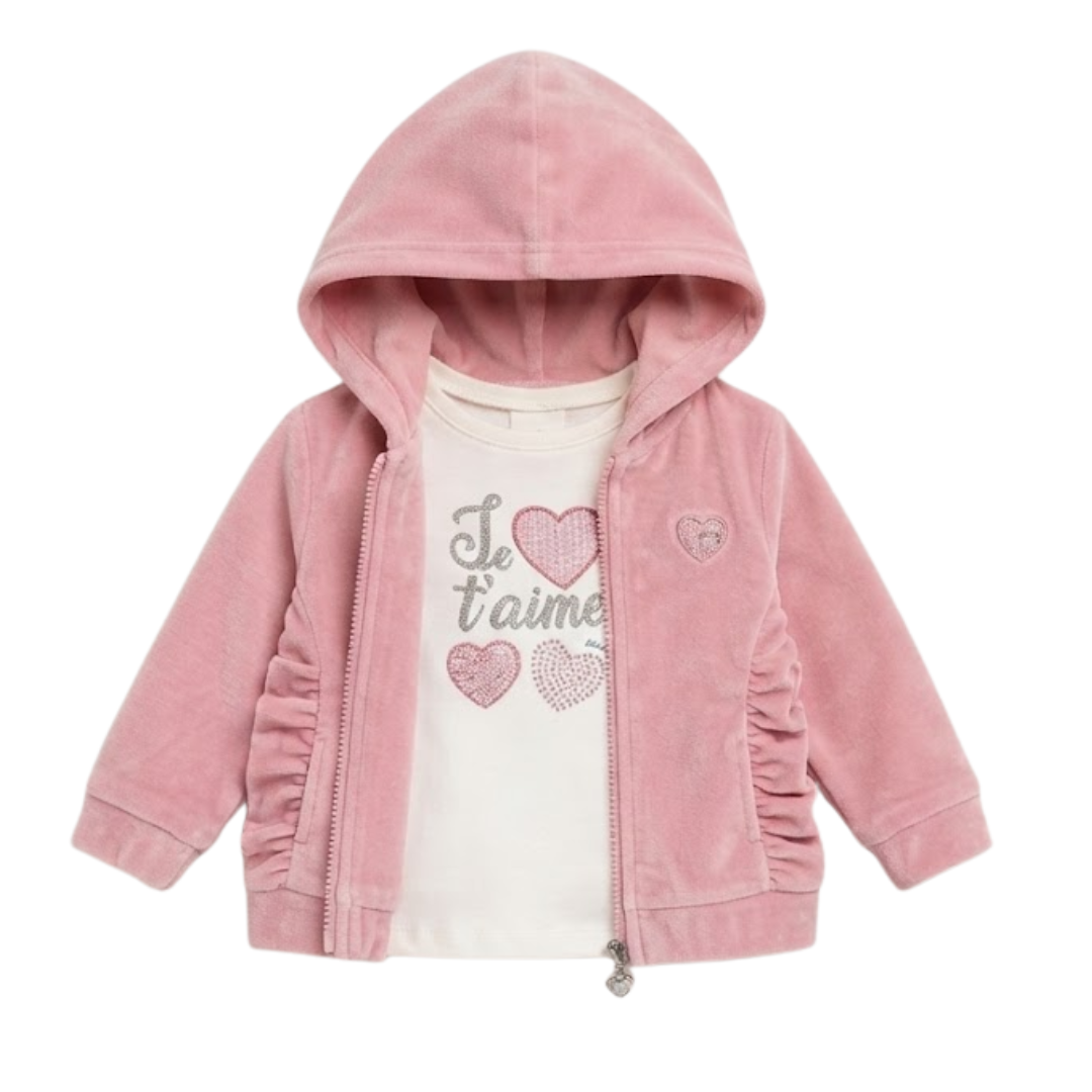 A pink hooded zip-up jacket for toddlers, featuring a soft velour texture, ruffled details on the sleeves and hem, and a white graphic t-shirt underneath with pink hearts and the text 'Je t'aime'.