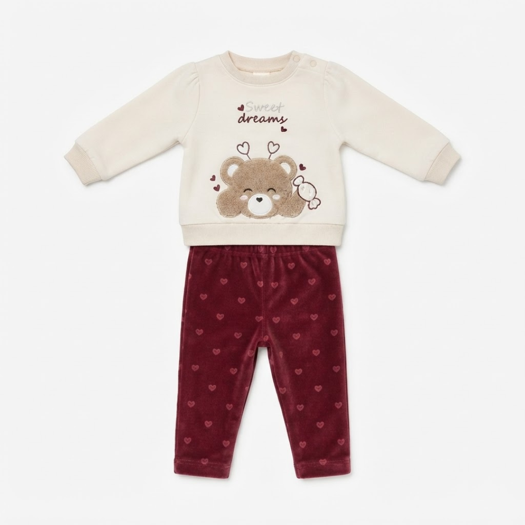 Layout of the baby girl cream sweatshirt and maroon velvet trousers set on a clean white background