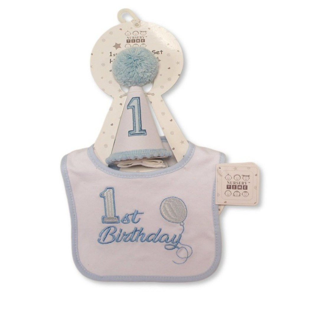 Baby first birthday set including a light blue and white bib with '1st Birthday' embroidery, a matching party hat, and a hanging display card on a white background.