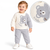 A baby boy wearing a two-piece waffle-knit sweater and pants set in cream and light gray, featuring a bear face graphic and 'Hello' text. An inset circle shows a close-up of the bear graphic and knit texture.