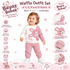A baby girl wearing a pink and cream waffle fabric outfit set, featuring a long-sleeve cream top with a pink bear applique and matching pink waffle knit pants. The image is a promotional infographic for the 'Beyaz Bebek' brand, showing the child in the center with various feature callouts and icons highlighting the waffle fabric, button closure, bear applique, ribbed cuffs, and comfort.