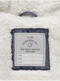 Textile product with a label on a textured white background