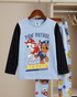 Children's pajama set with Paw Patrol design on a hanger.