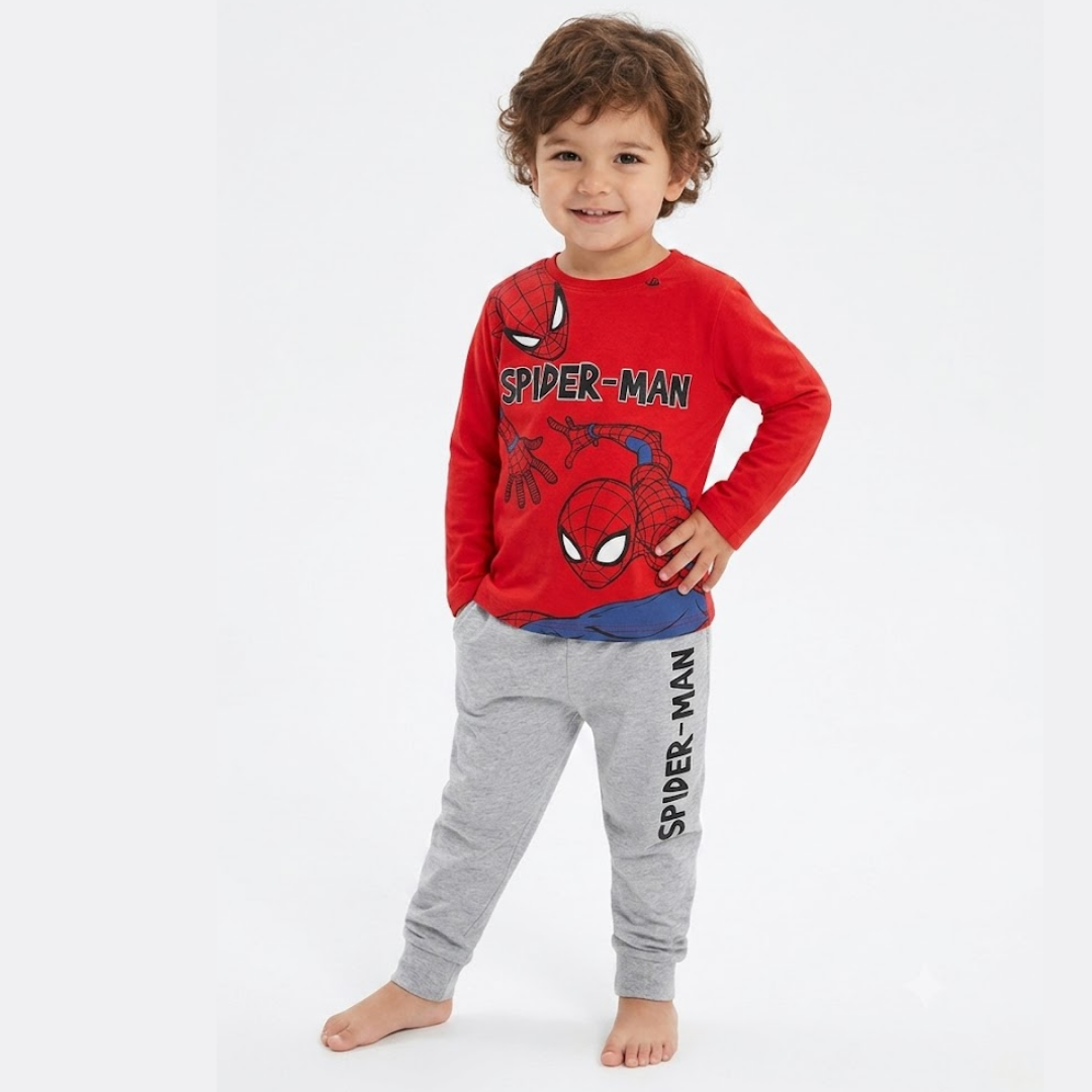 Child wearing Spider-Man pajamas on a white background