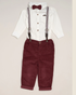 Children's outfit with white shirt, suspenders, maroon bow tie, and pants on a beige background