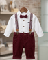 Children's outfit with white shirt, maroon pants, suspenders, and bow tie on a hanger.