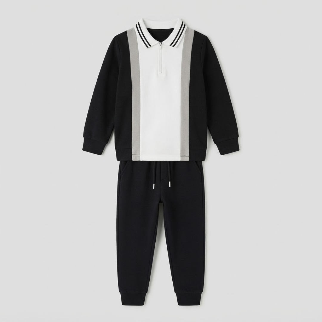 A two-piece kids' tracksuit set featuring a black long-sleeve polo shirt with a white center panel and gray side panels, paired with black jogger pants with a drawstring waist.