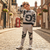 A boy wearing  Grey Graffiti Print Tracksuit standing in England street