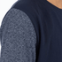 Navy blue long-sleeve shirt with textured gray sleeves on a plain background