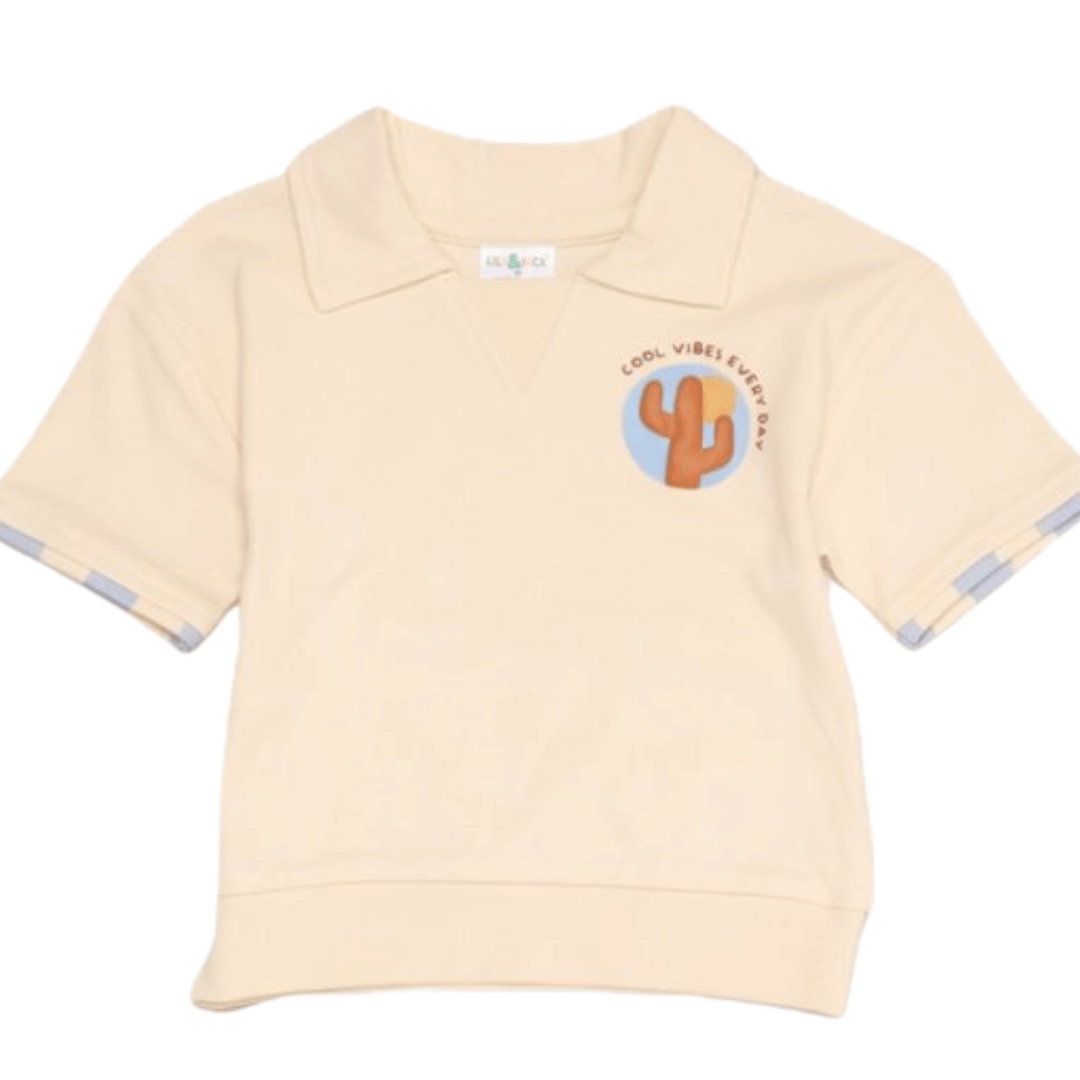 Beige baby sweater with cactus graphic and text on a white background