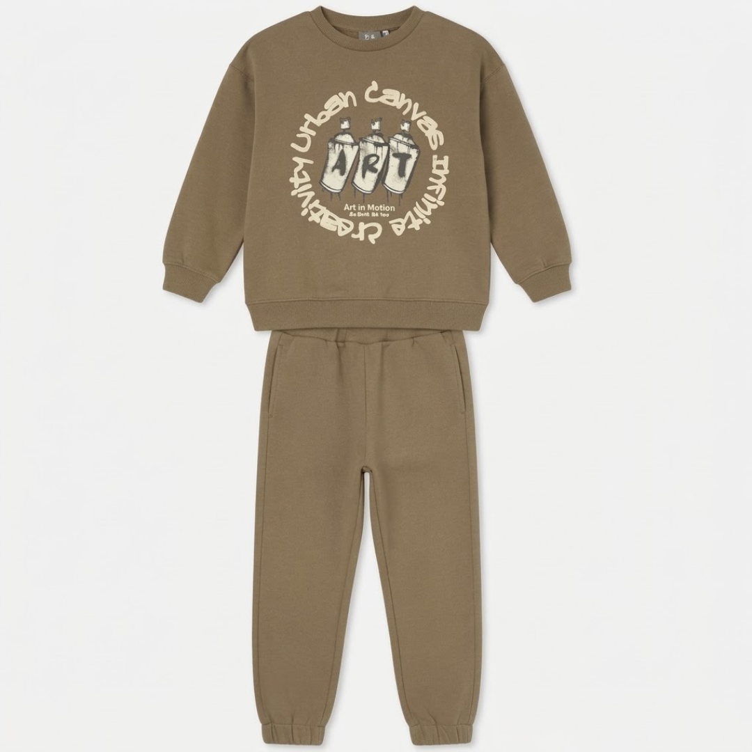 A two-piece kids' sweatshirt and jogger pants set in a muted brownish-green (taupe/khaki) color. The sweatshirt features a cream-colored graphic print on the front with the words 'Urban Canvas' and illustrations of paintbrushes.