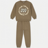 A two-piece kids' sweatshirt and jogger pants set in a muted brownish-green (taupe/khaki) color. The sweatshirt features a cream-colored graphic print on the front with the words 'Urban Canvas' and illustrations of paintbrushes.