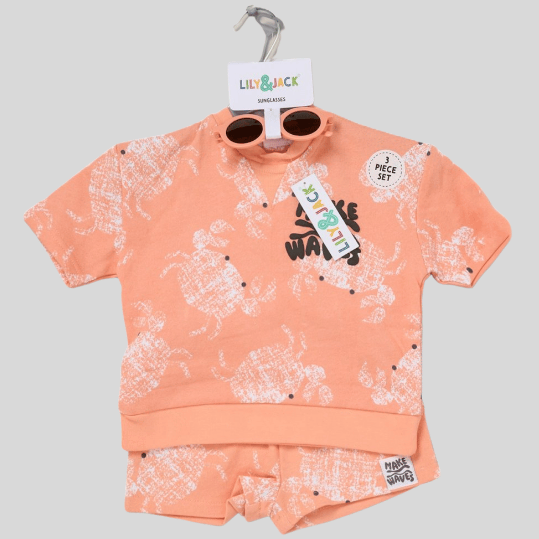 Children's peach-colored outfit with white patterns on a gray background
