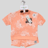 Children's peach-colored outfit with white patterns on a gray background
