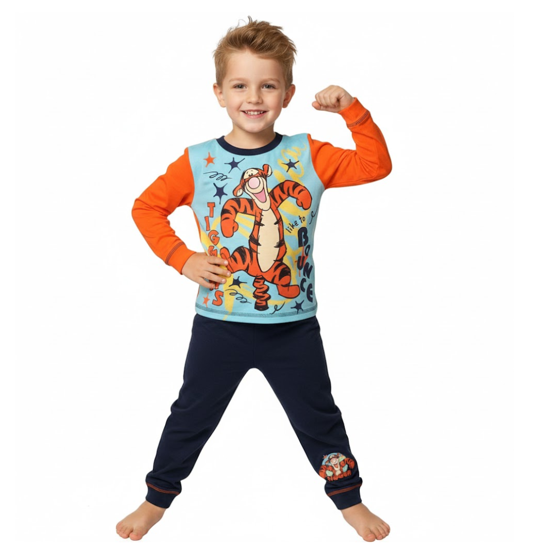 Child wearing a Tigger-themed pajama set on a white background