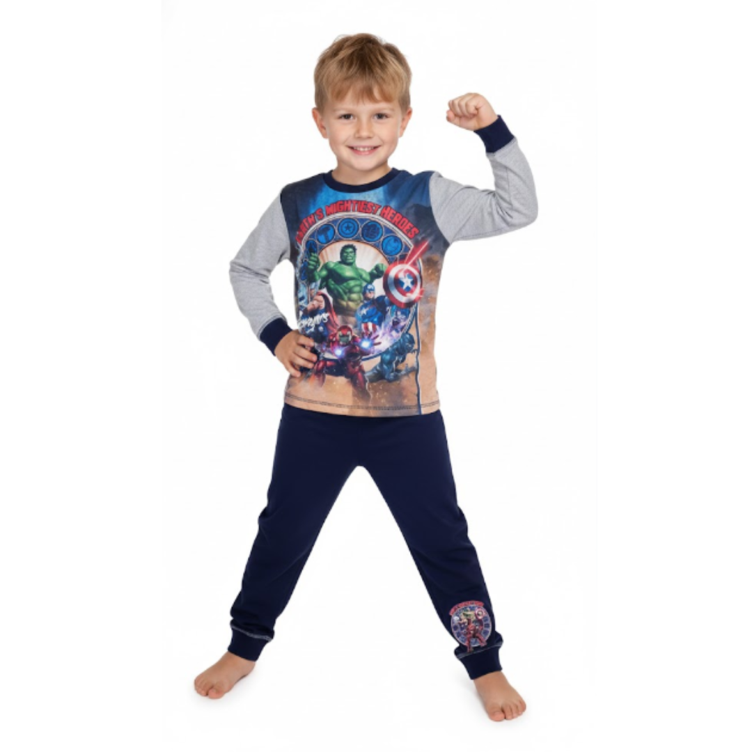 Child wearing superhero-themed pajamas on a white background
