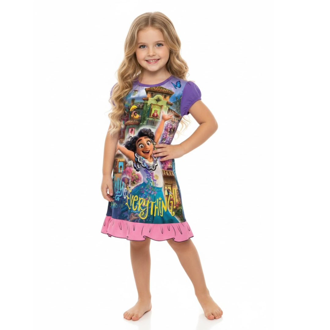 Young girl wearing a colorful dress with cartoon characters on a white background