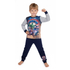 Child wearing superhero-themed pajamas on a white background